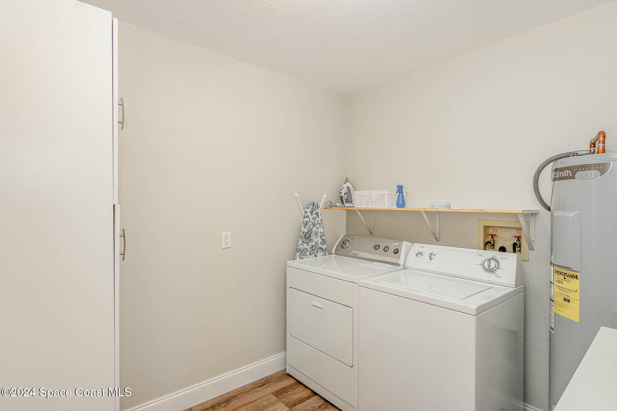 300 South Banana River Boulevard, Unit 305 Cocoa Beach, FL 32931 - Photo 21 of 36 a utility room with dryer and washer