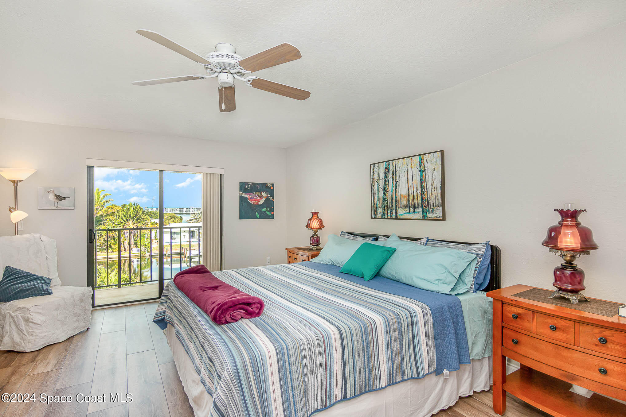 300 South Banana River Boulevard, Unit 305 Cocoa Beach, FL 32931 - Photo 25 of 36 a bedroom with a large bed and a window