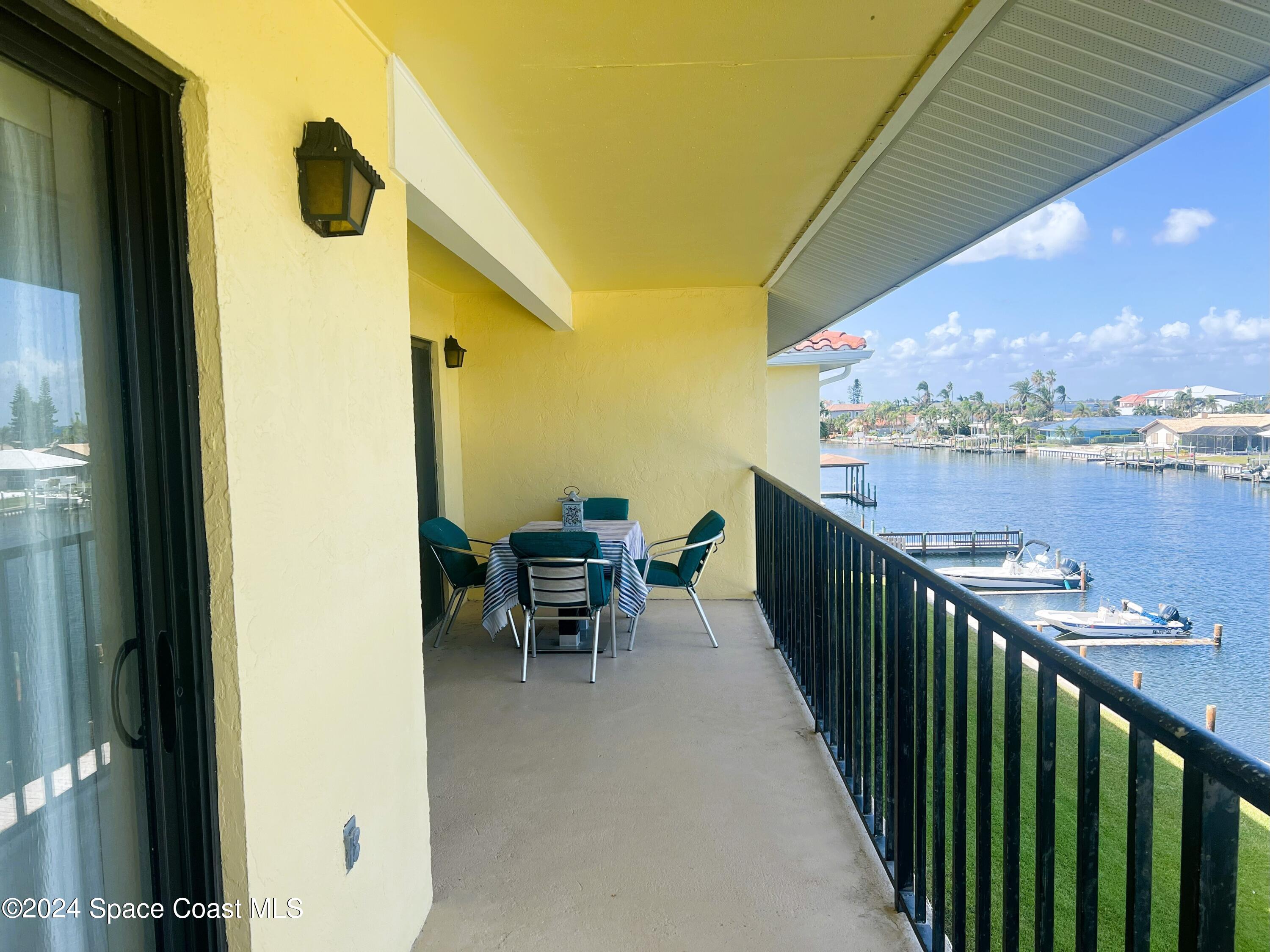 300 South Banana River Boulevard, Unit 305 Cocoa Beach, FL 32931 - Photo 29 of 36 a view of a balcony with furniture