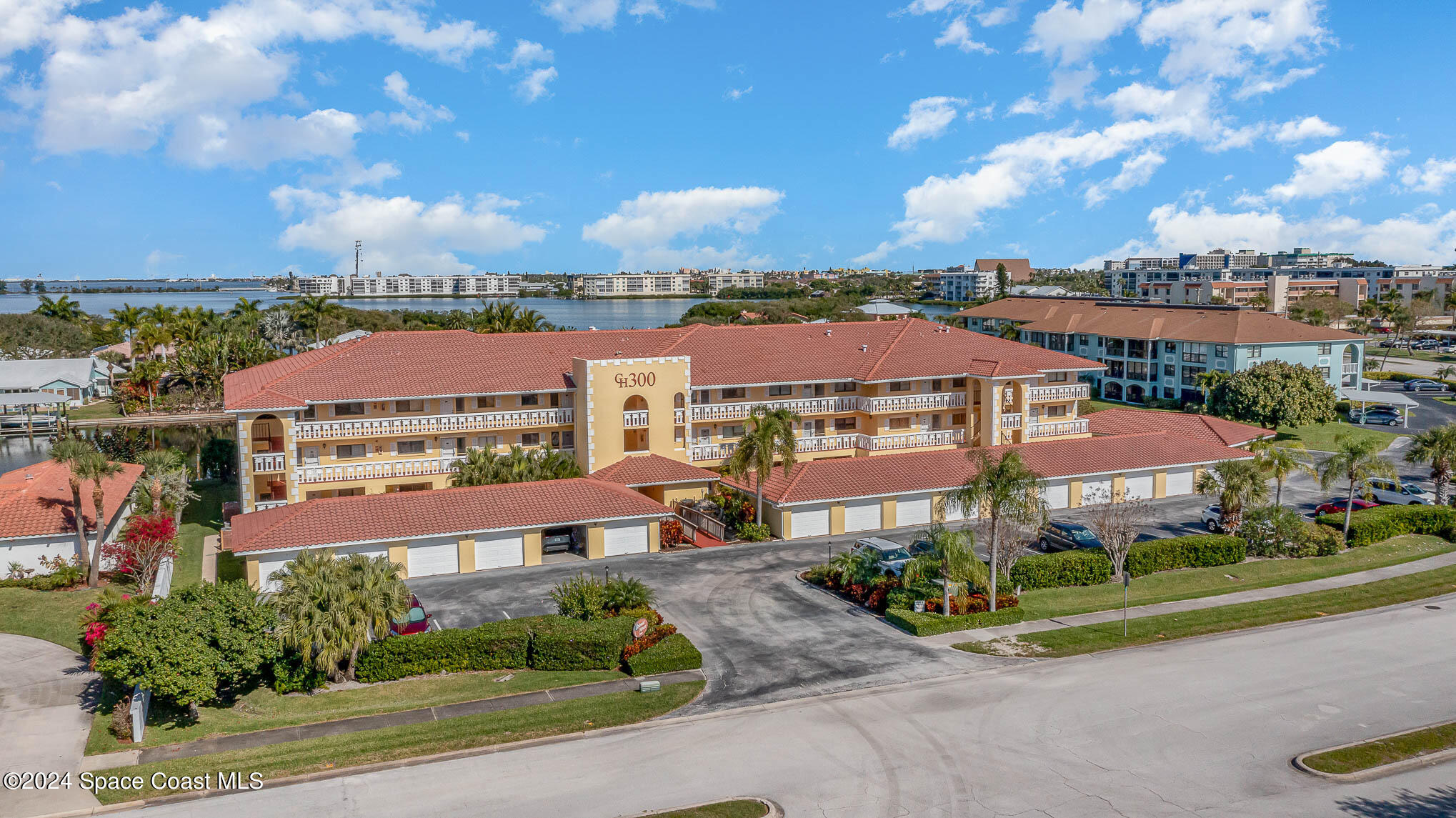 300 South Banana River Boulevard, Unit 305 Cocoa Beach, FL 32931 - Photo 33 of 36 an aerial view of residential houses with outdoor space and ocean view
