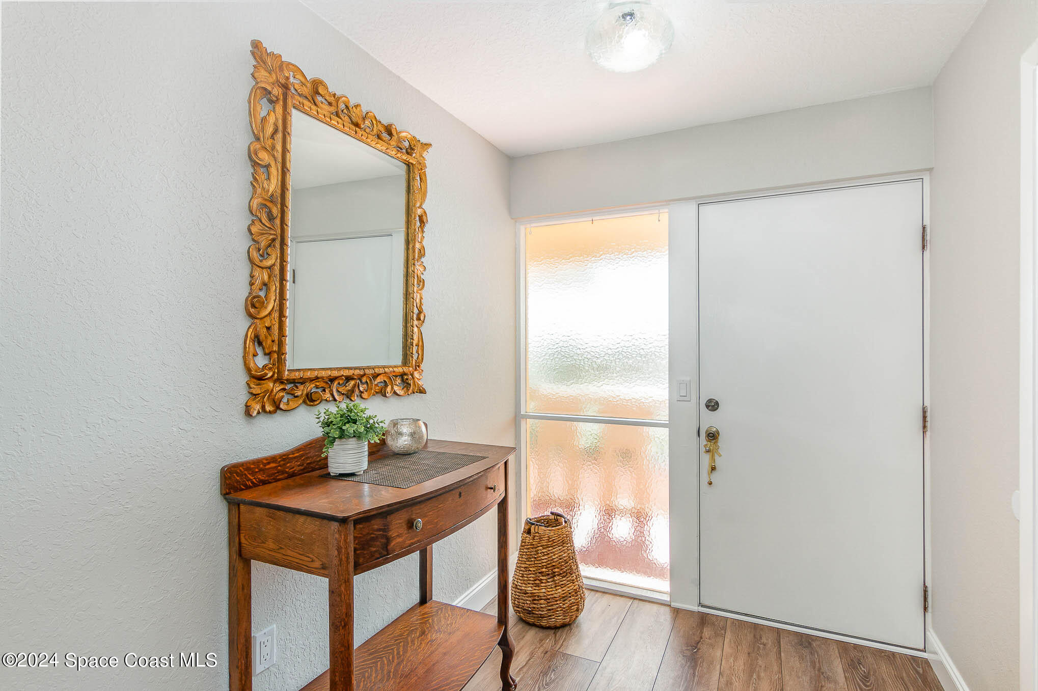 300 South Banana River Boulevard, Unit 305 Cocoa Beach, FL 32931 - Photo 6 of 36 a bathroom with a sink and a mirror