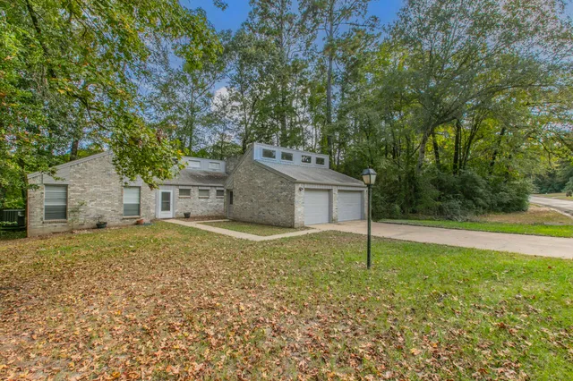 a house view with a backyard space