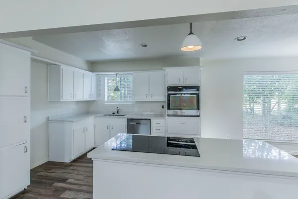 a kitchen that has a microwave and a sink