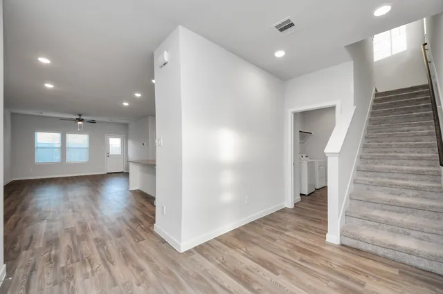 a view of gallery with wooden floor