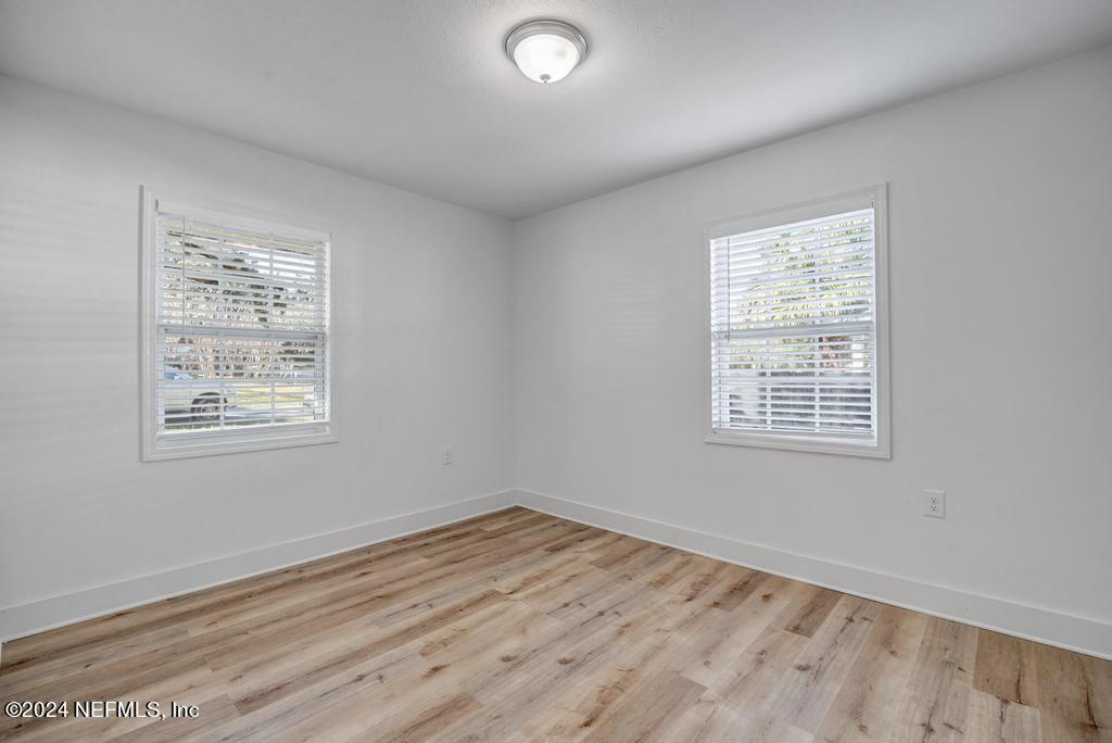 903 Royal Road St. Augustine, FL 32086 - Photo 24 of 32 a view of an empty room with wooden floor and a window