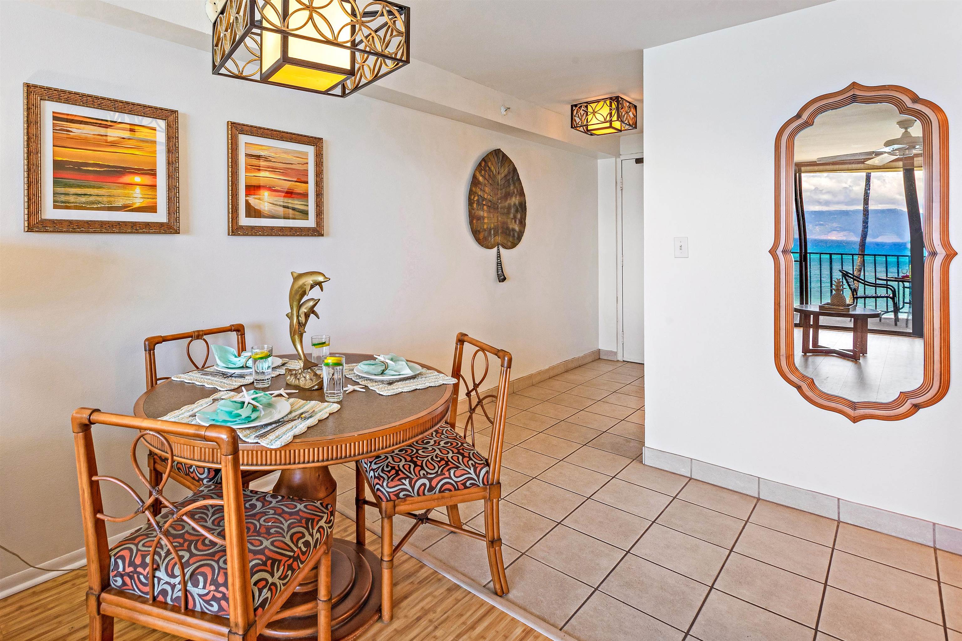 4327 Lower Honoapiilani Road, Unit 406B Lahaina, HI 96761 - Photo 14 of 26 a view of a dining room with furniture and a window