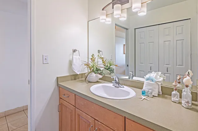 a bathroom with a sink double vanity and a mirror