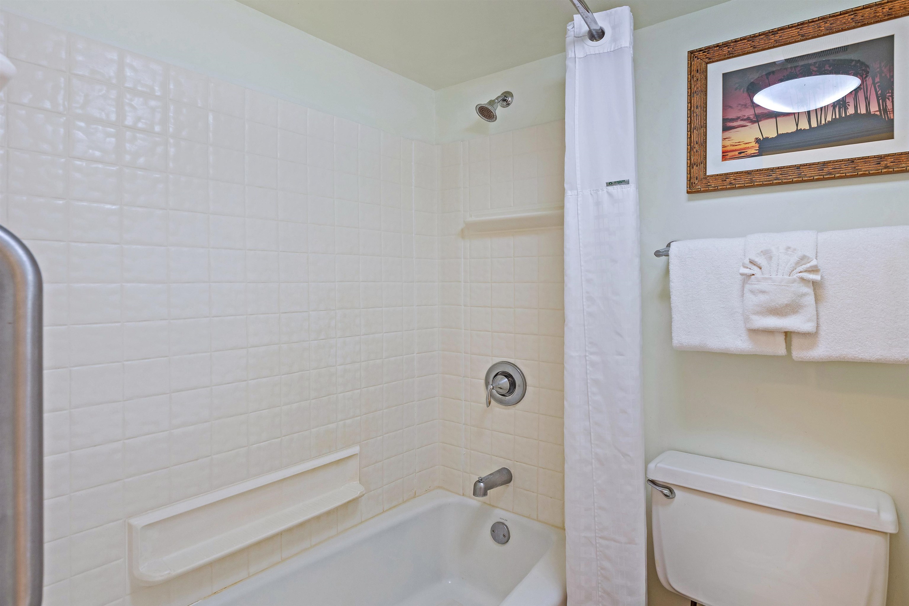4327 Lower Honoapiilani Road, Unit 406B Lahaina, HI 96761 - Photo 19 of 26 a bathroom with a toilet and a shower