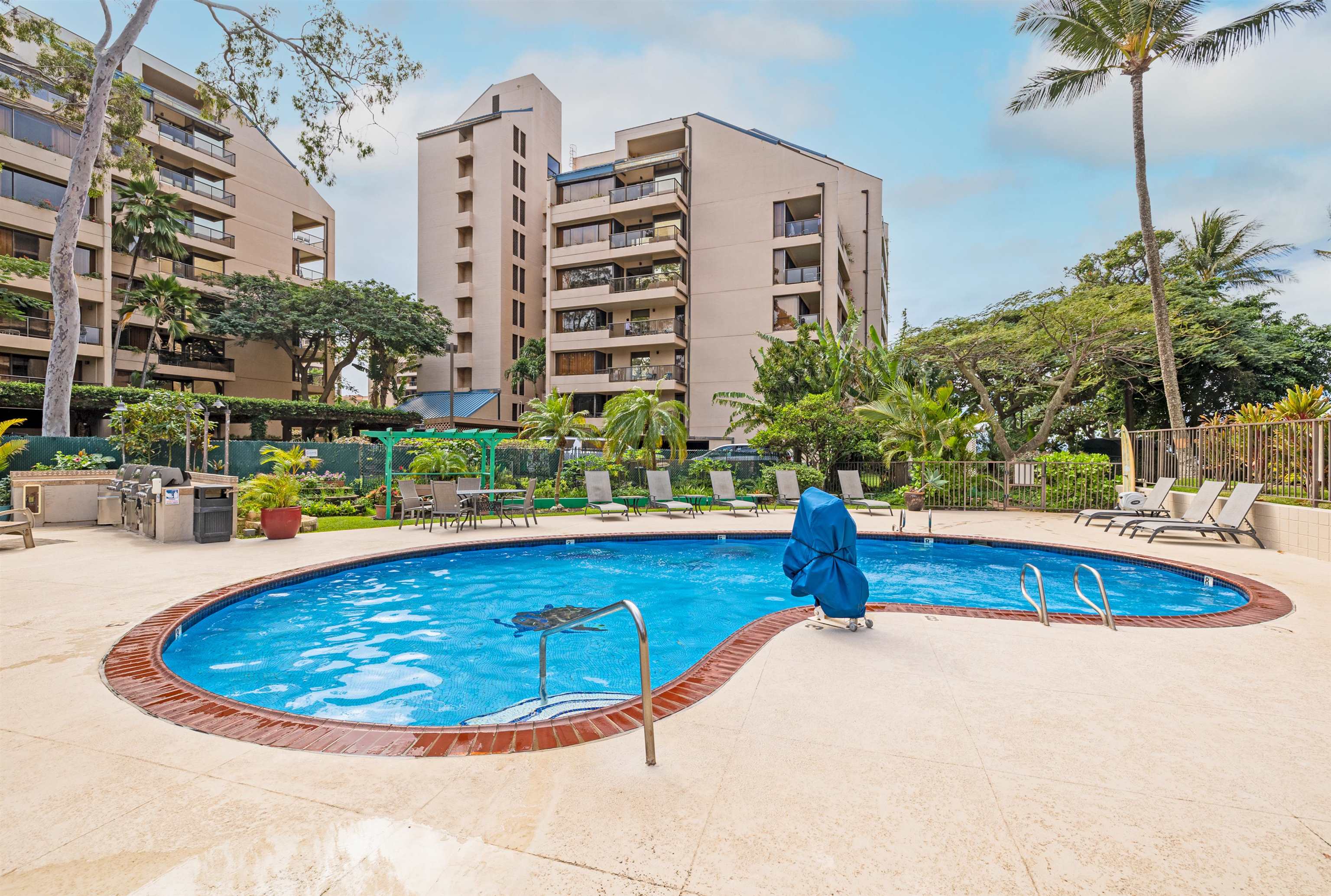 4327 Lower Honoapiilani Road, Unit 406B Lahaina, HI 96761 - Photo 22 of 26 a view of a swimming pool with a patio