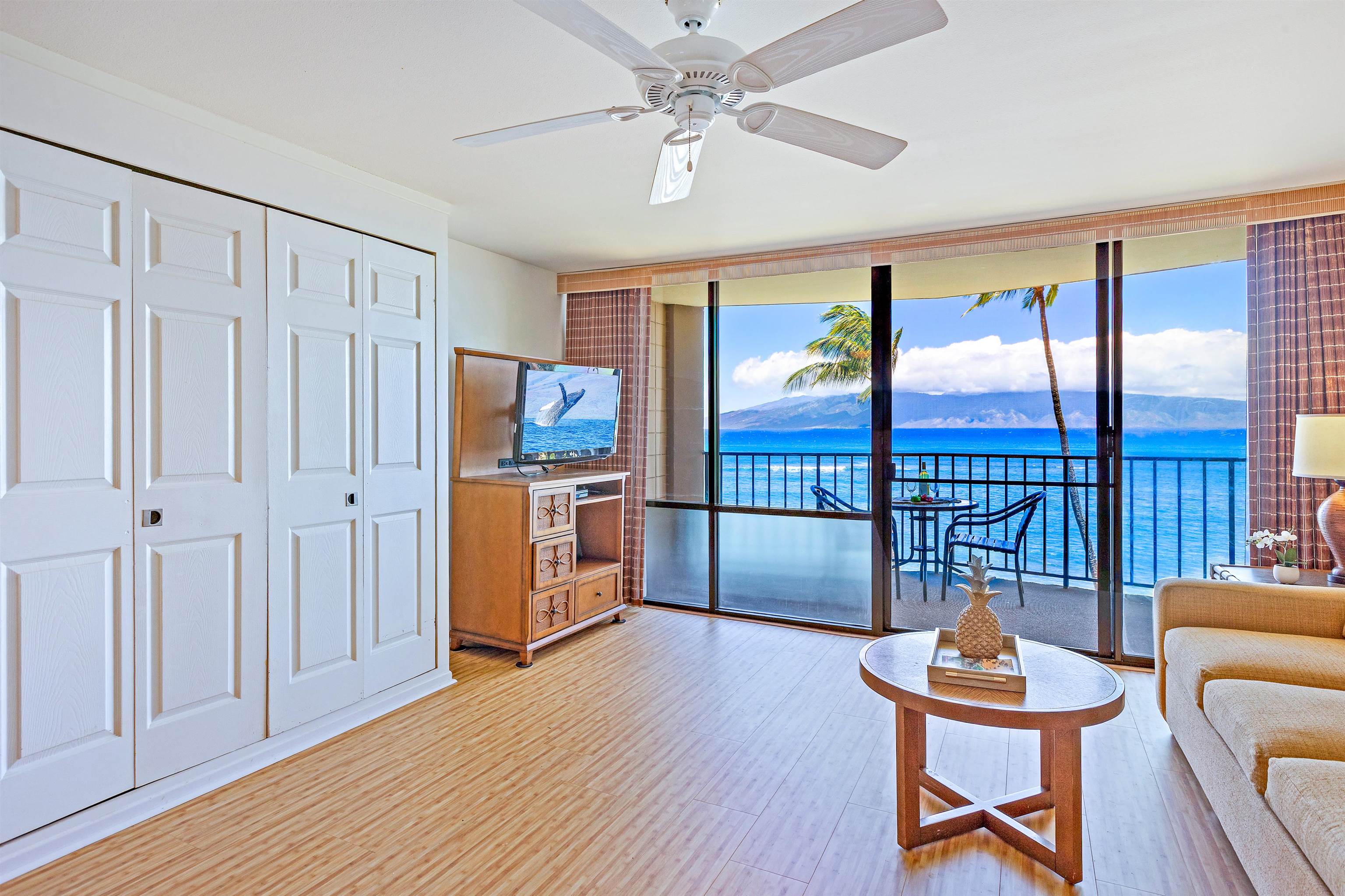 4327 Lower Honoapiilani Road, Unit 406B Lahaina, HI 96761 - Photo 4 of 26 a room with furniture and a window