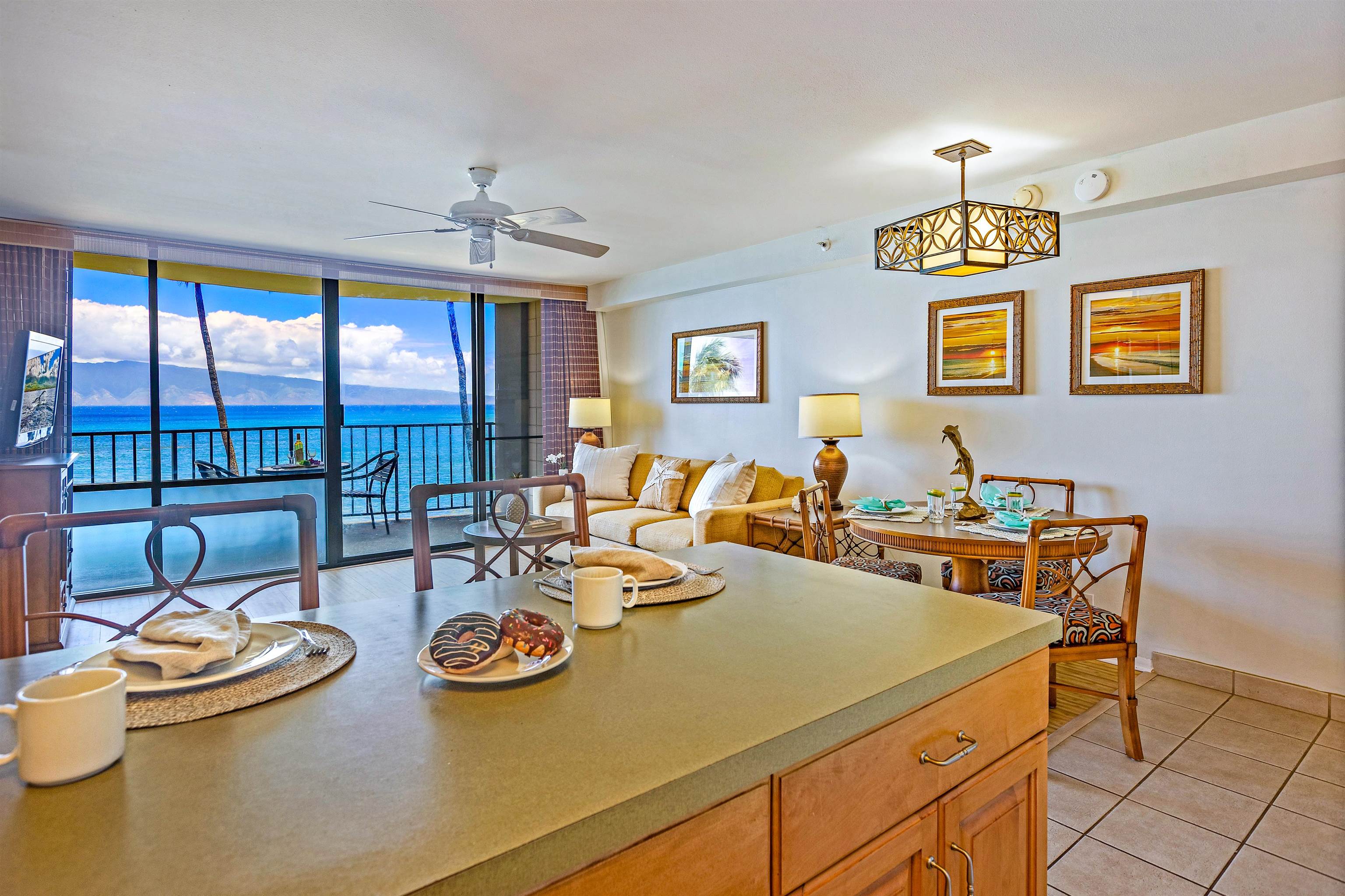 4327 Lower Honoapiilani Road, Unit 406B Lahaina, HI 96761 - Photo 6 of 26 a view of a dining room with furniture