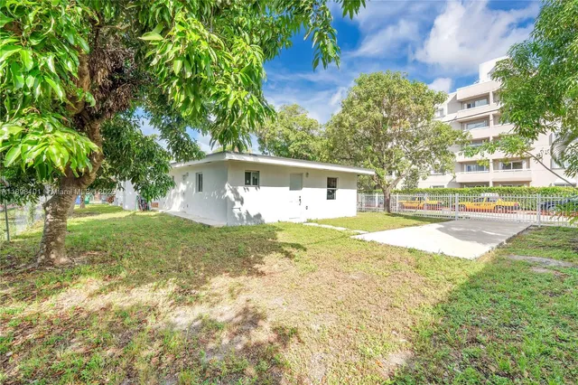 a view of a house with a small yard