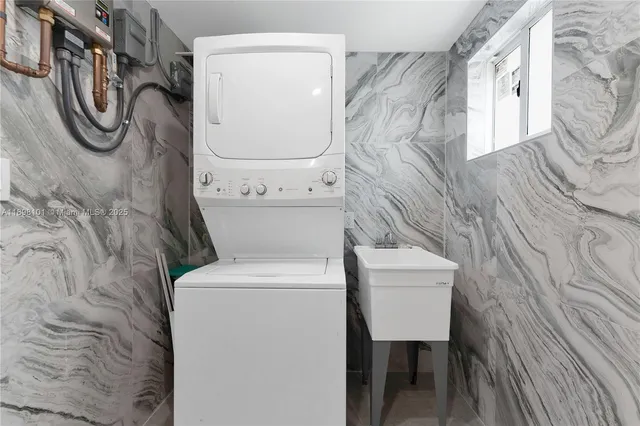 a utility room with dryer and washer