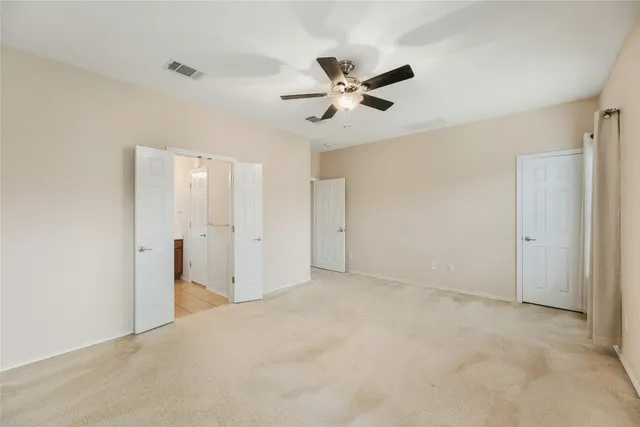 a bathroom with a bathtub shower sink vanity and toilet