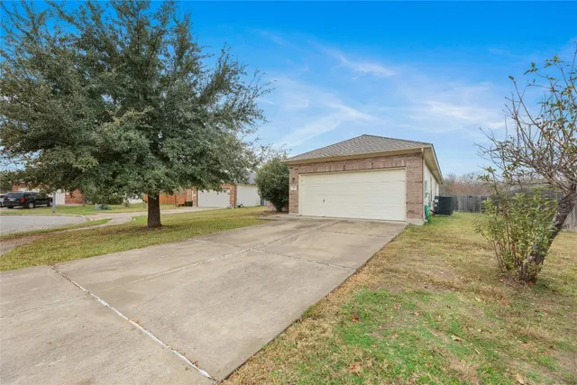 en empty room with a fireplace and windows