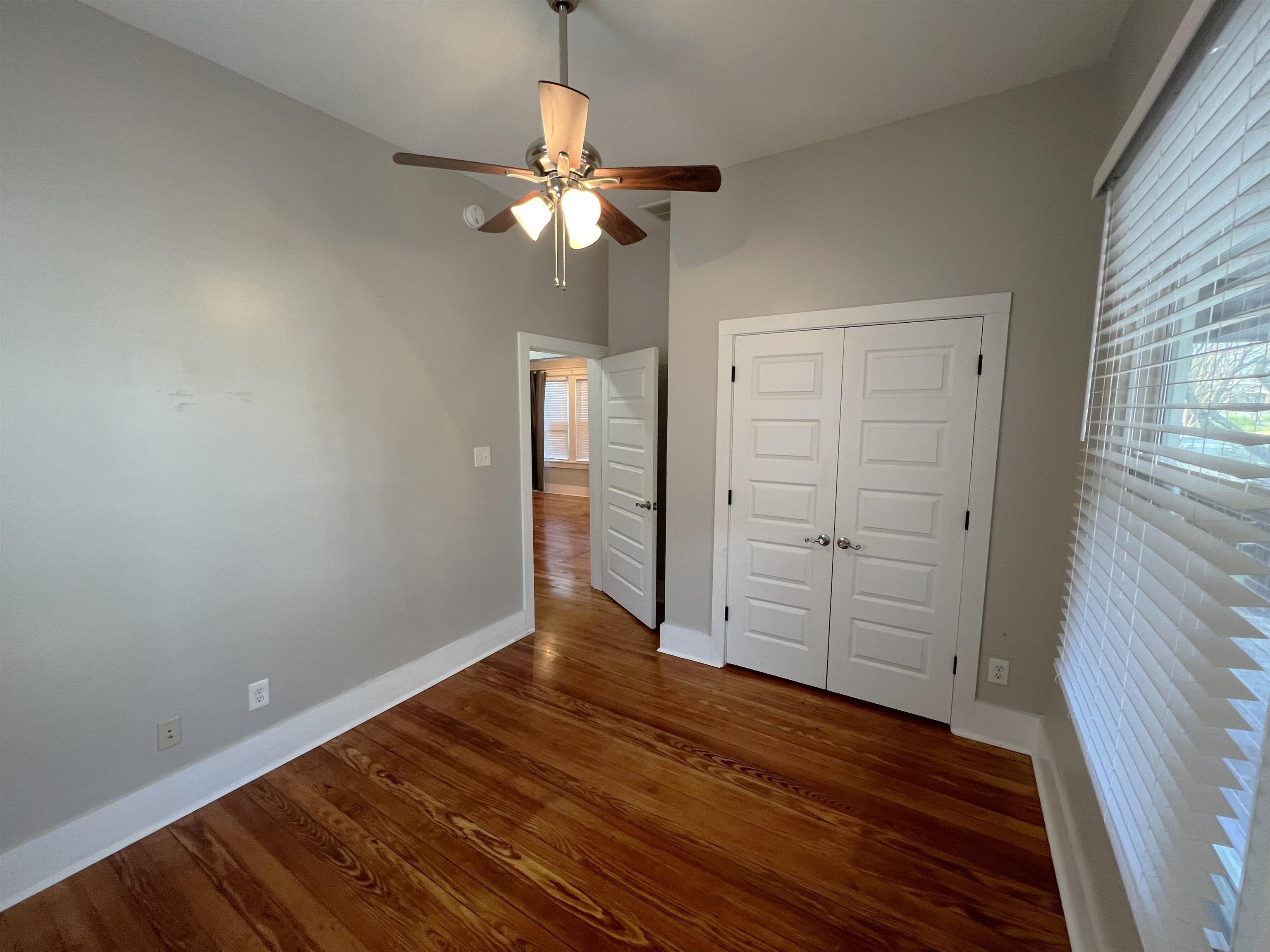 897 South Cox Street Memphis, TN 38104 - Photo 11 of 14 wooden floor in an empty room with a window