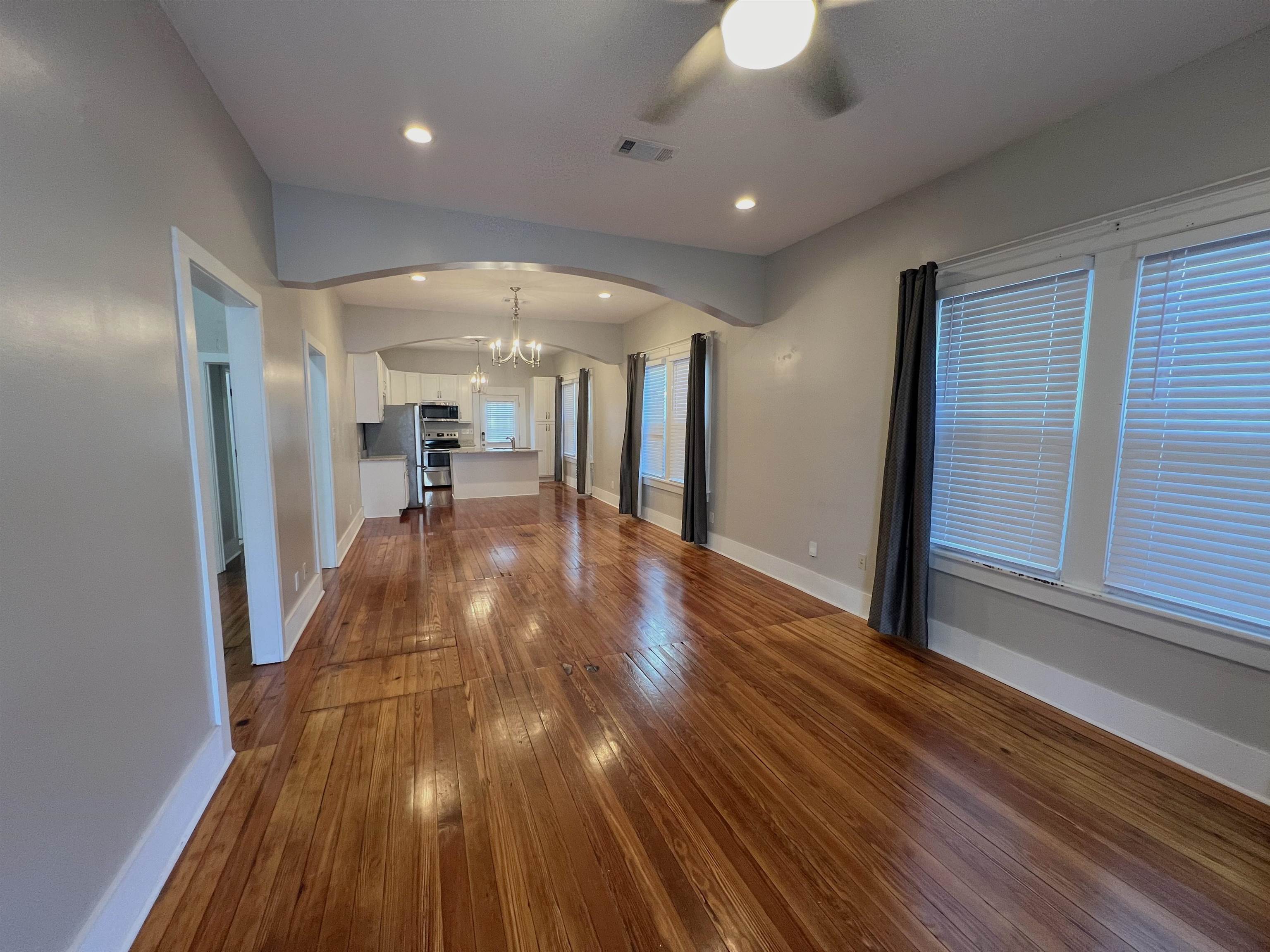 897 South Cox Street Memphis, TN 38104 - Photo 2 of 14 a view of a hallway with wooden floor