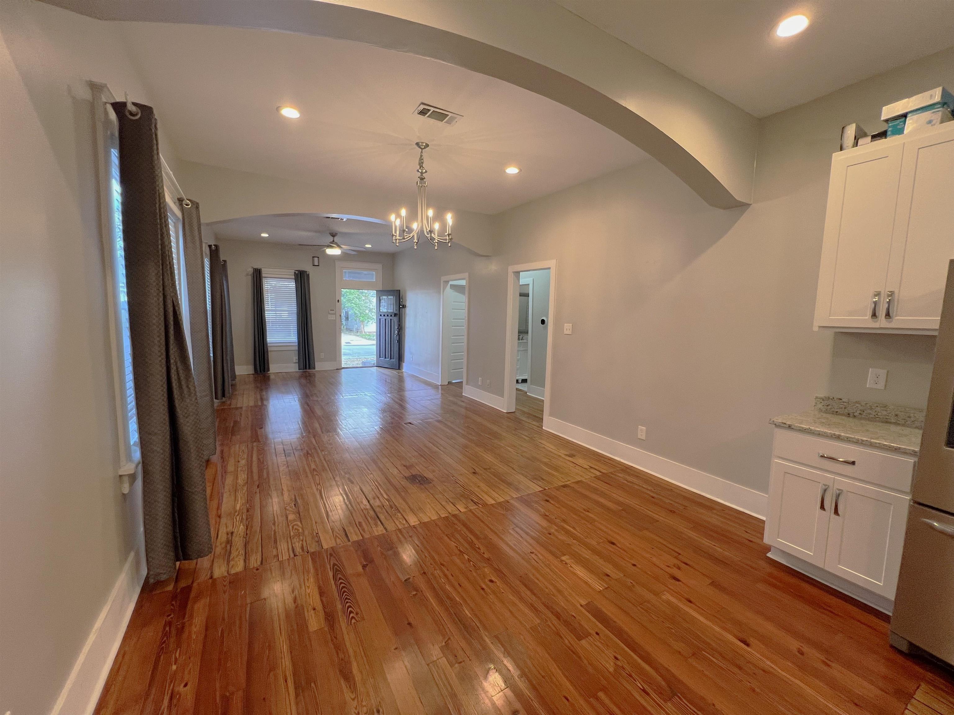 897 South Cox Street Memphis, TN 38104 - Photo 4 of 14 a view of a hallway with wooden floor and chandelier