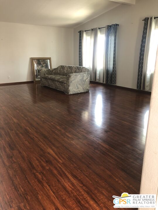 69525 Dillon Road, Unit 73 Desert Hot Springs, CA 92241 - Photo 11 of 48 a living room with furniture and wooden floor