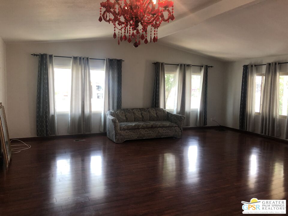 69525 Dillon Road, Unit 73 Desert Hot Springs, CA 92241 - Photo 13 of 48 a living room with hardwood floor and windows