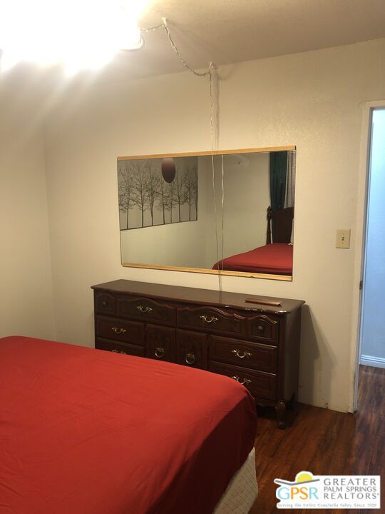 69525 Dillon Road, Unit 73 Desert Hot Springs, CA 92241 - Photo 18 of 48 a room with a bed and a dresser