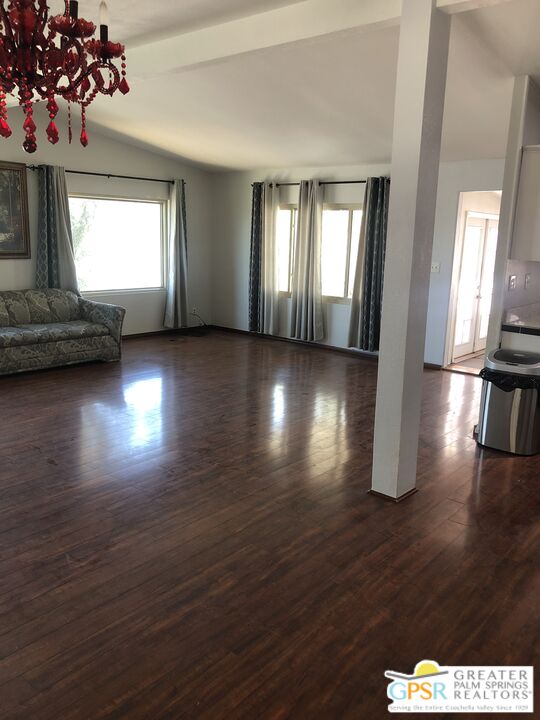 69525 Dillon Road, Unit 73 Desert Hot Springs, CA 92241 - Photo 41 of 48 a view of empty room with wooden floor and fan