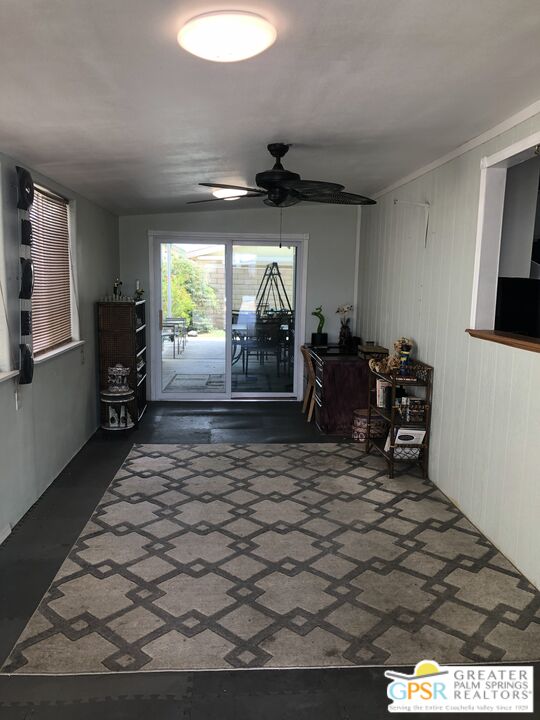 69525 Dillon Road, Unit 73 Desert Hot Springs, CA 92241 - Photo 5 of 48 a living room with furniture and a large window