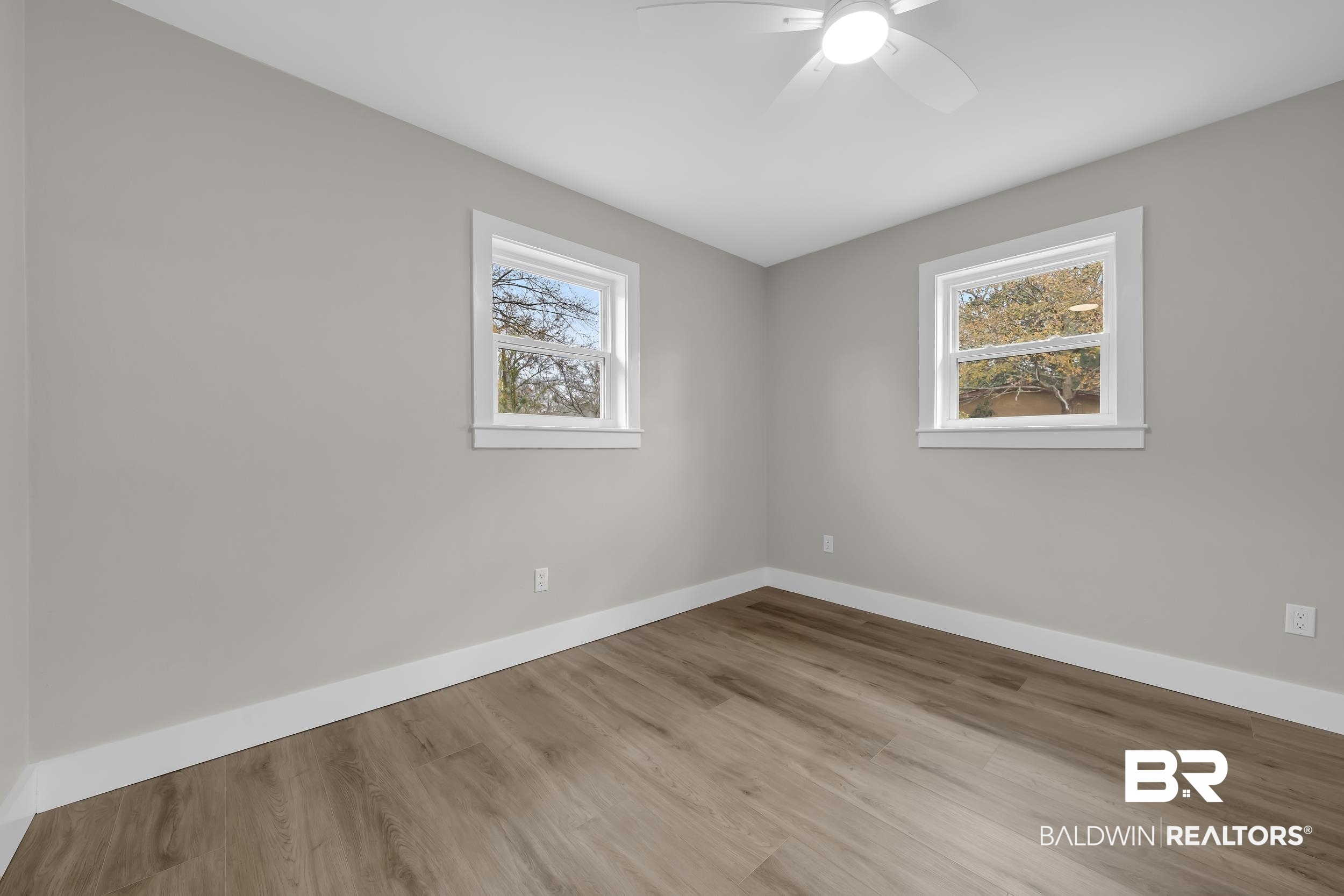 11381 Normandy Drive East Semmes, AL 36575 - Photo 12 of 23 Unfurnished room with wood finished floors and a ceiling fan