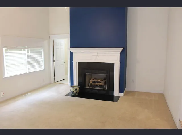 a living room with a fireplace