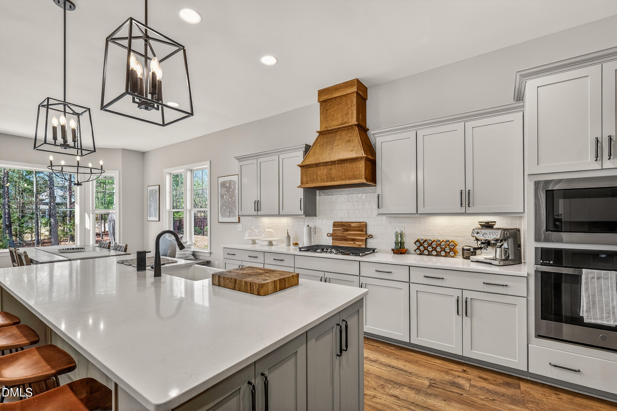210 Lookout Ridge Pittsboro, NC 27312 - Photo 21 of 59 a kitchen with stainless steel appliances a sink a stove and cabinets