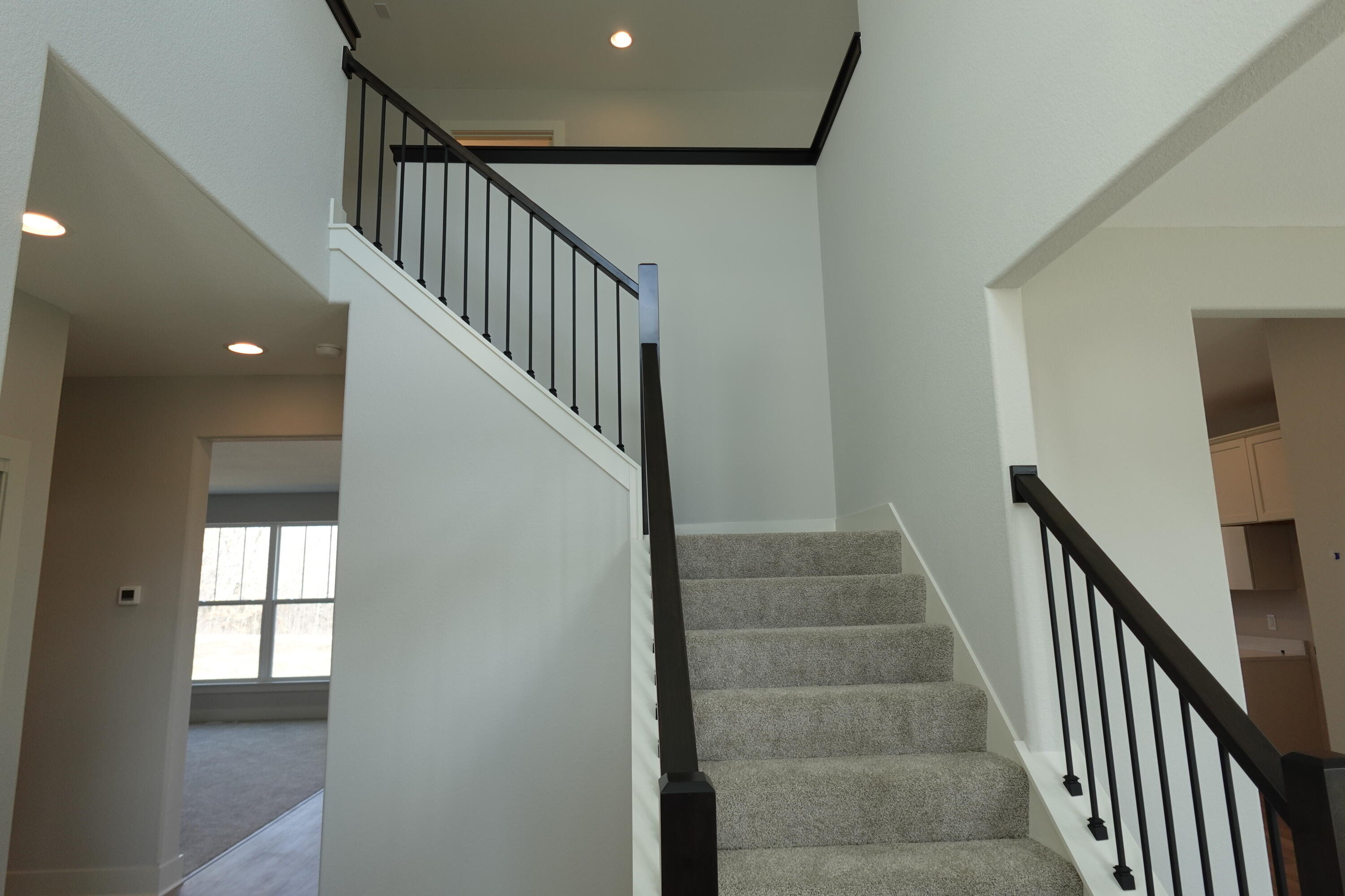 511 Woodside Court West Bend, WI 53095 - Photo 11 of 49 Foyer Staircase