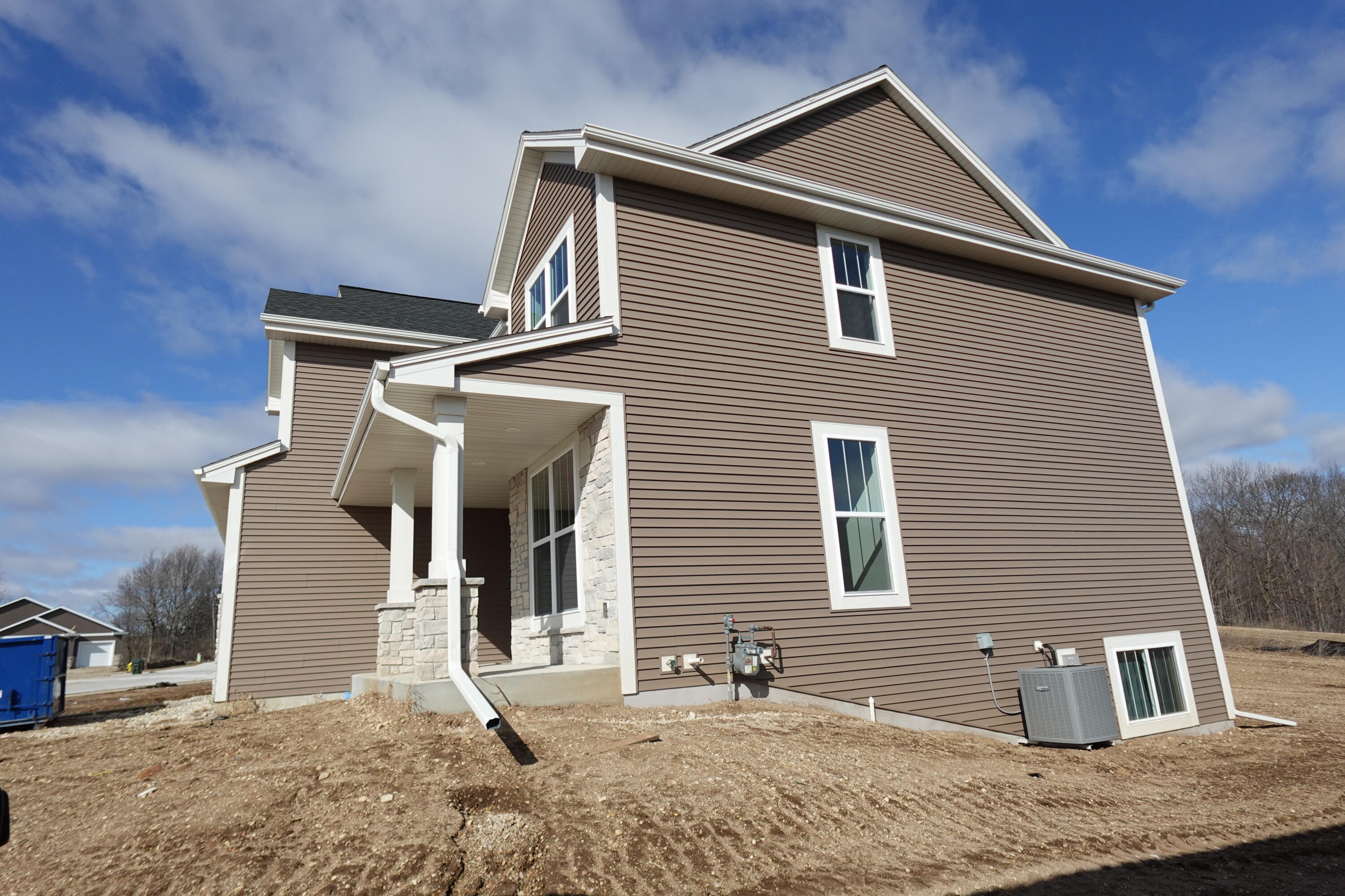 511 Woodside Court West Bend, WI 53095 - Photo 4 of 49 Side Elevation