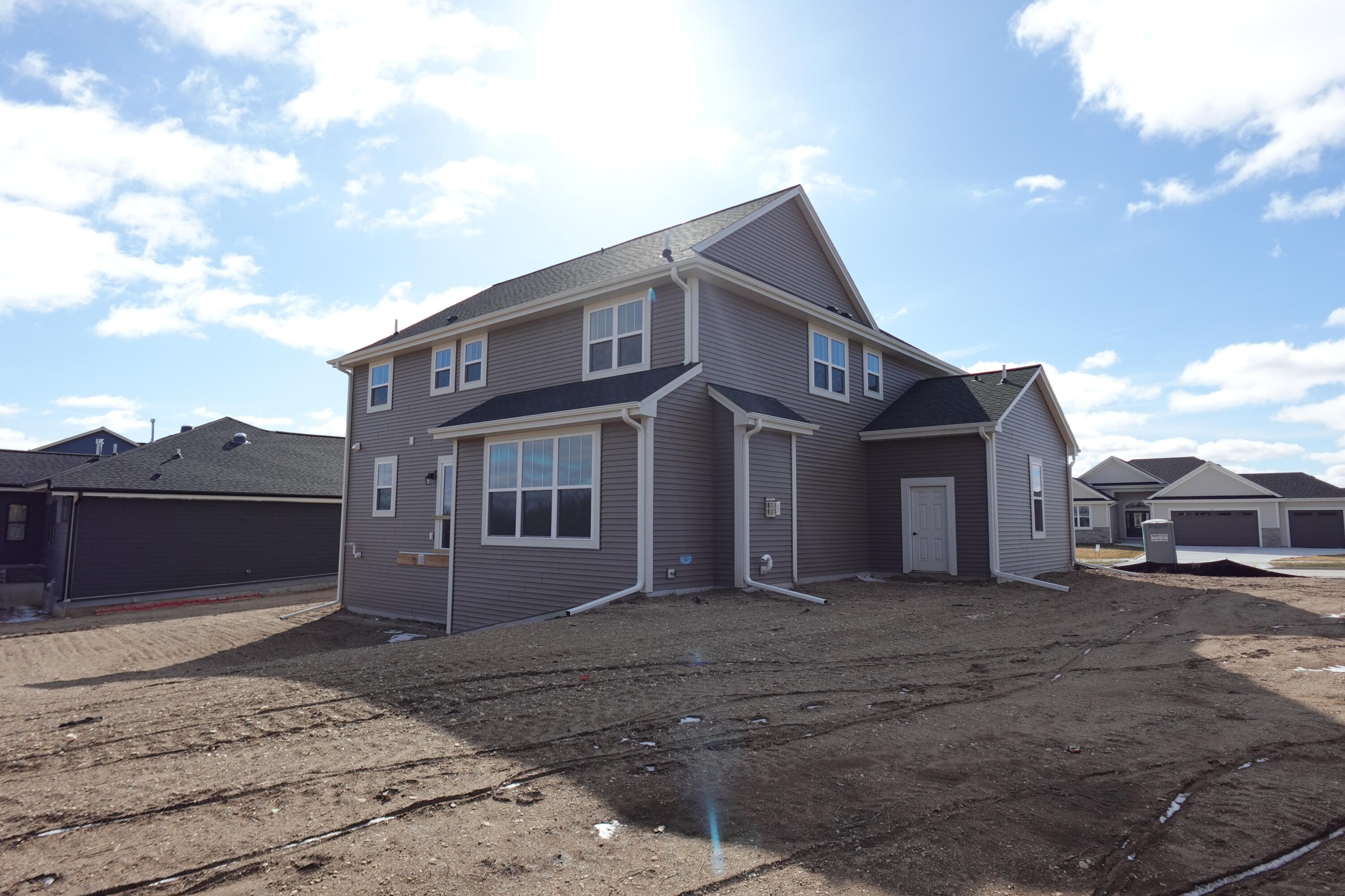 511 Woodside Court West Bend, WI 53095 - Photo 5 of 49 Rear/Side Elevations