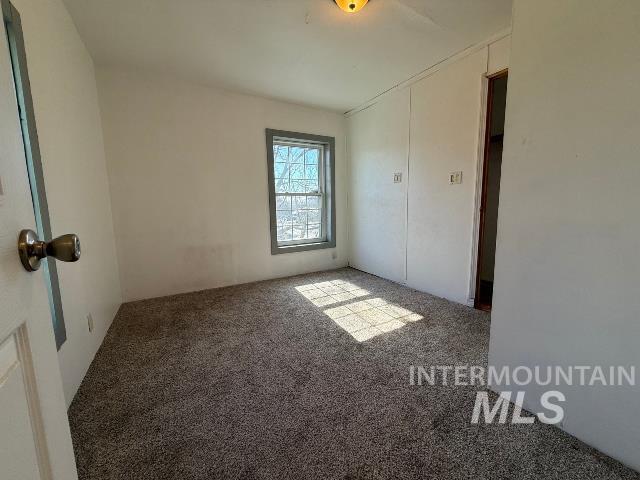 902 East Main Street Weiser, ID 83672 - Photo 18 of 45 Unfurnished bedroom featuring light carpet