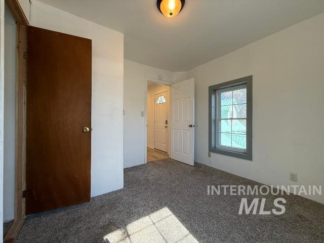 902 East Main Street Weiser, ID 83672 - Photo 21 of 45 Unfurnished bedroom featuring carpet flooring and a closet