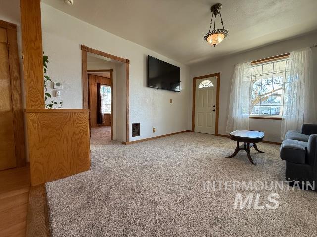 902 East Main Street Weiser, ID 83672 - Photo 5 of 45 Living room featuring light colored carpet and baseboards