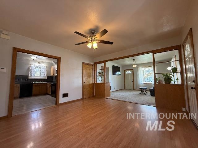 902 East Main Street Weiser, ID 83672 - Photo 6 of 45 Unfurnished living room with a ceiling fan and light wood-style flooring