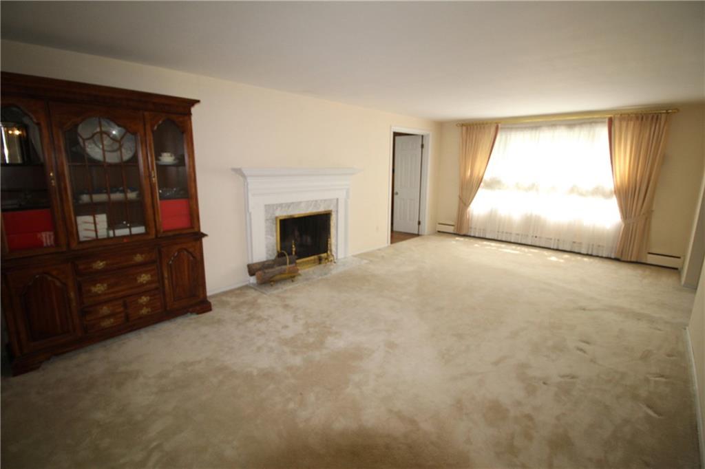 217 Navajo Road Pittsburgh, PA 15241 - Photo 3 of 25 Spacious living room with fireplace.