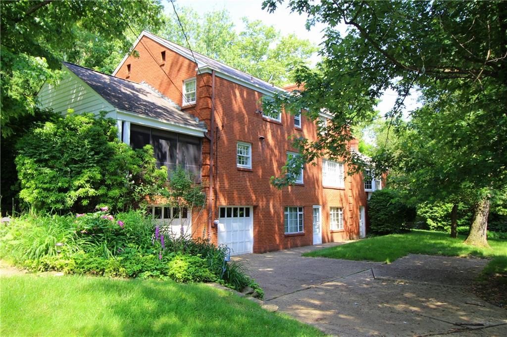 217 Navajo Road Pittsburgh, PA 15241 - Photo 22 of 25 Level driveway from side street leads to the two car garage.