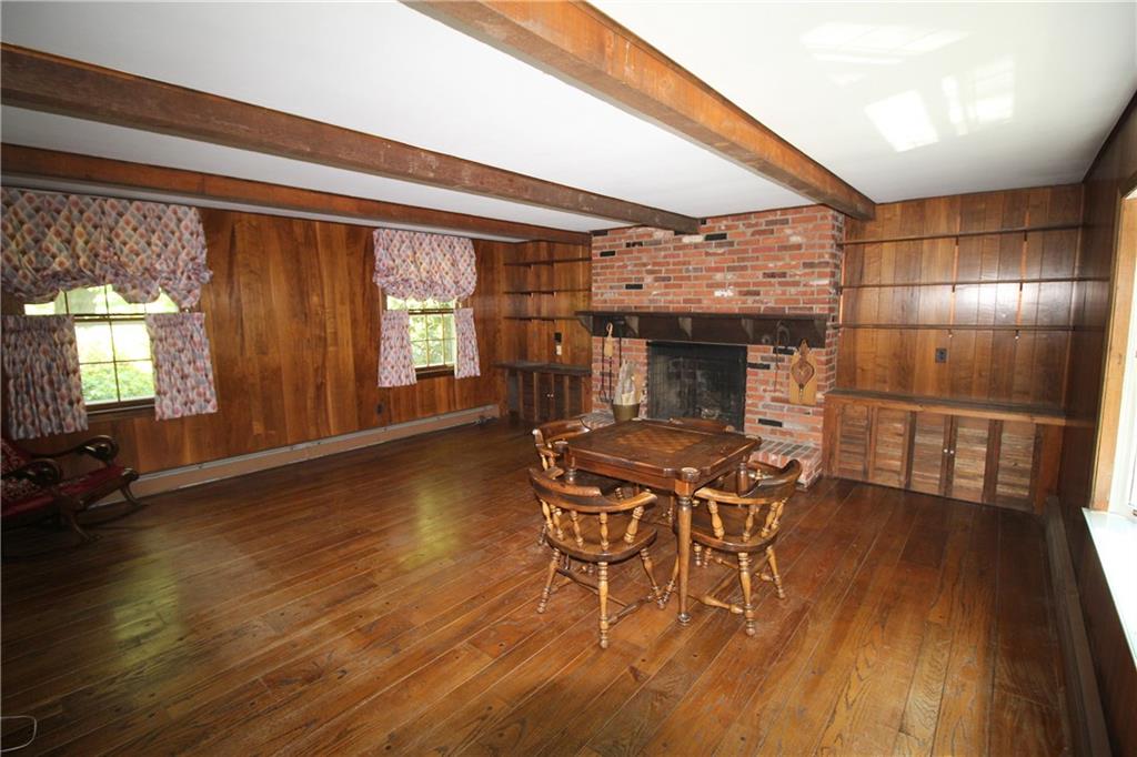 217 Navajo Road Pittsburgh, PA 15241 - Photo 4 of 25 Huge first floor family room with brick fireplace flanked by built-ins.
