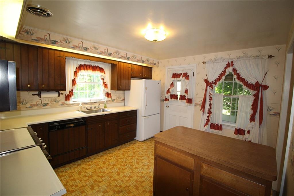 217 Navajo Road Pittsburgh, PA 15241 - Photo 7 of 25 The kitchen has a door to the side porch.