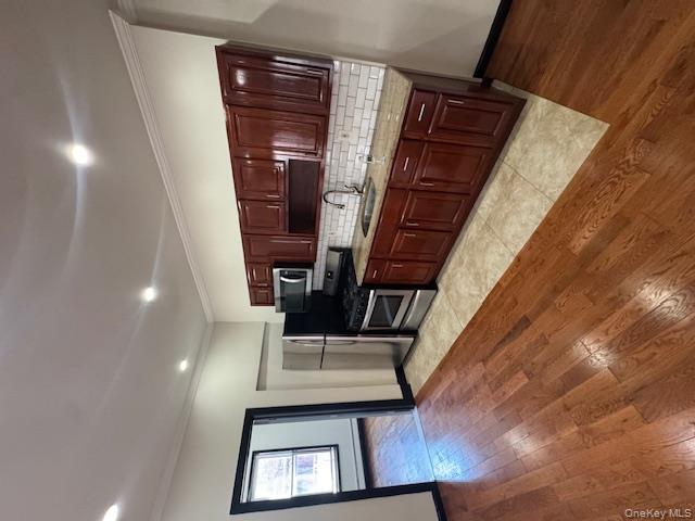 1586 Prospect Place, Unit 2R Brooklyn, NY 11233 - Photo 1 of 1 a kitchen with stainless steel appliances granite countertop a stove sink and cabinets