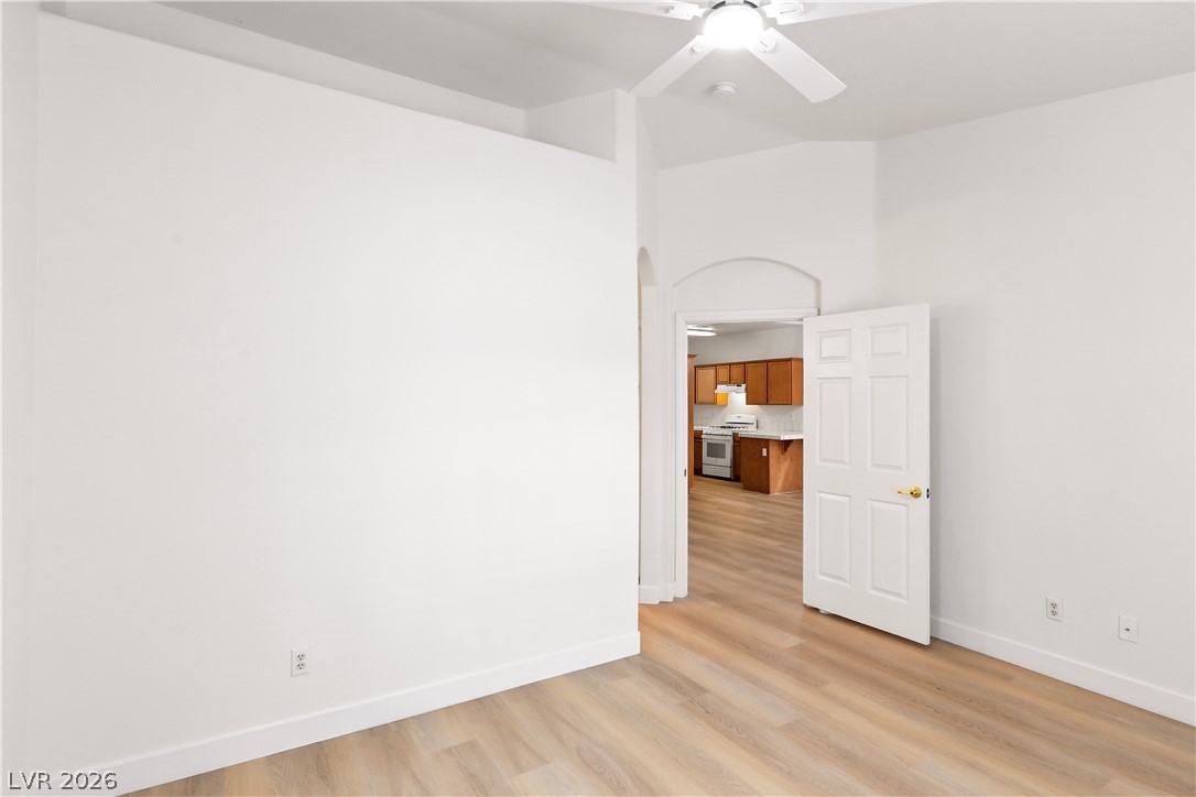 1134 Evening Ridge Street Henderson, NV 89052 - Photo 19 of 35 A versatile open space flows seamlessly into a well-appointed kitchen, ideal for diverse living arrangements.