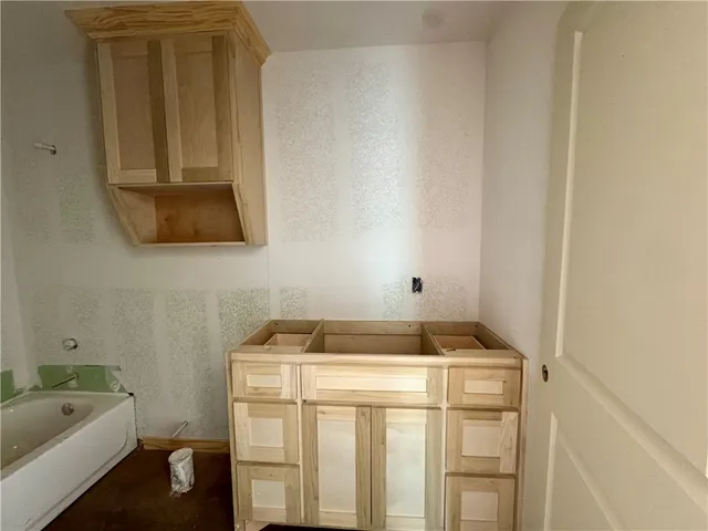 a bathroom with a sink and a bathtub