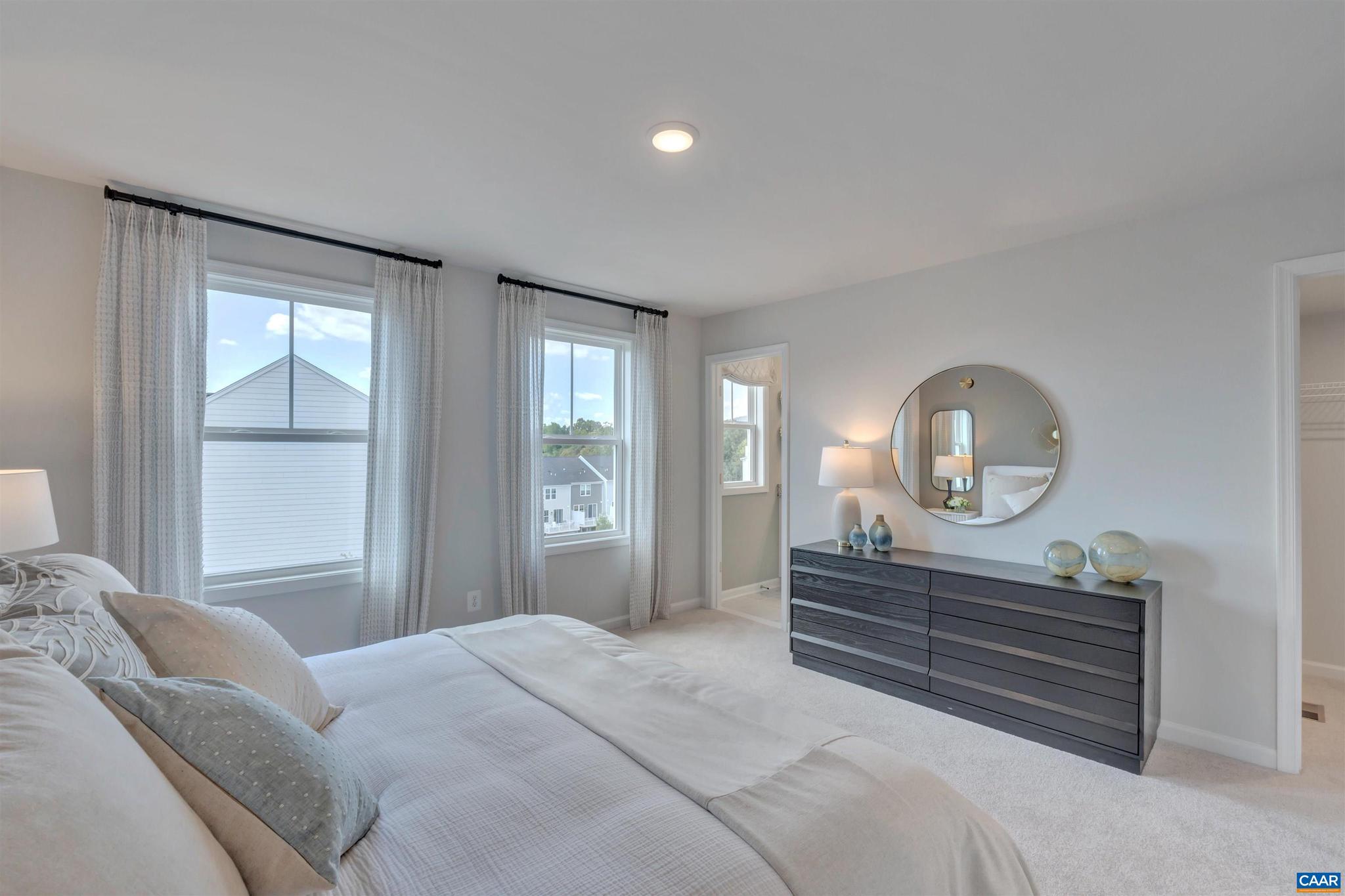 3000 Rambling Brk Lane, Unit 120 Crozet, VA 22932 - Photo 12 of 44 a bedroom with a bed and a window