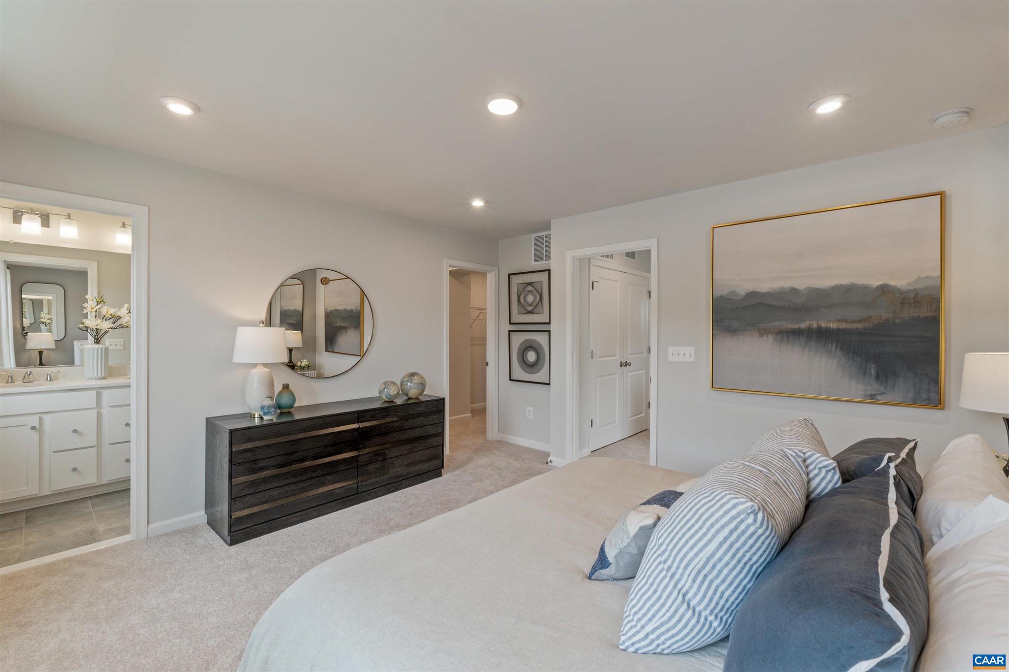 3000 Rambling Brk Lane, Unit 120 Crozet, VA 22932 - Photo 13 of 44 a bedroom with furniture and a wooden floor
