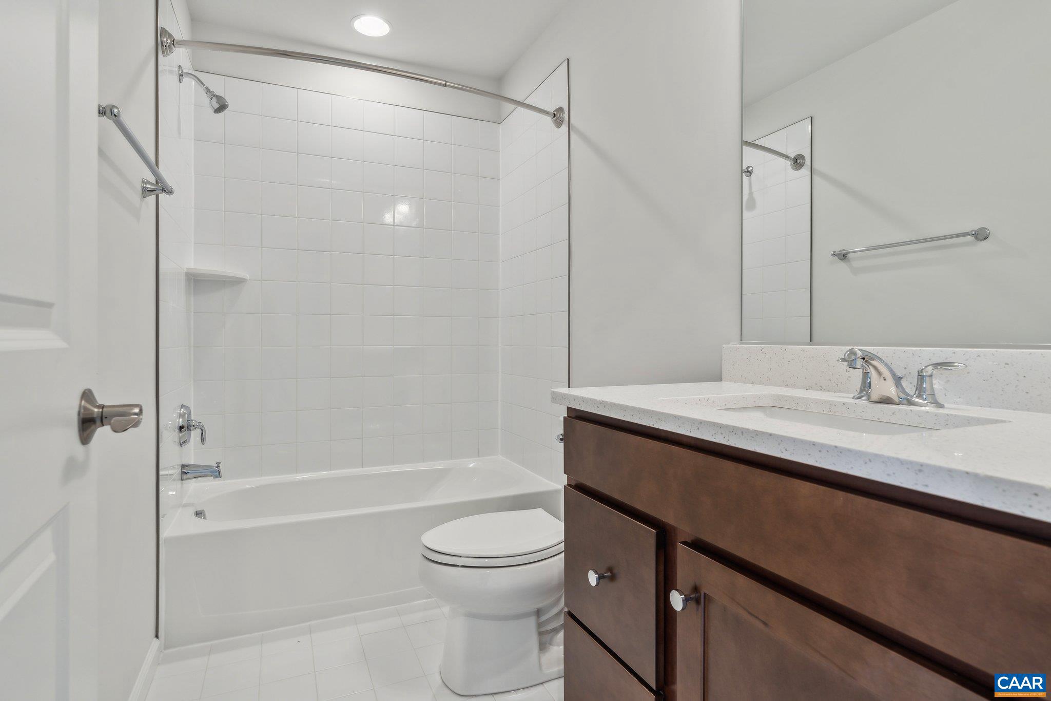 3000 Rambling Brk Lane, Unit 120 Crozet, VA 22932 - Photo 18 of 44 a bathroom with a granite countertop sink toilet and shower