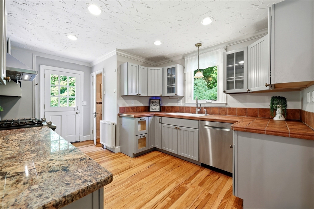 32 Lincoln Road Longmeadow, MA 01106 - Photo 6 of 36 a kitchen with a sink stove and refrigerator