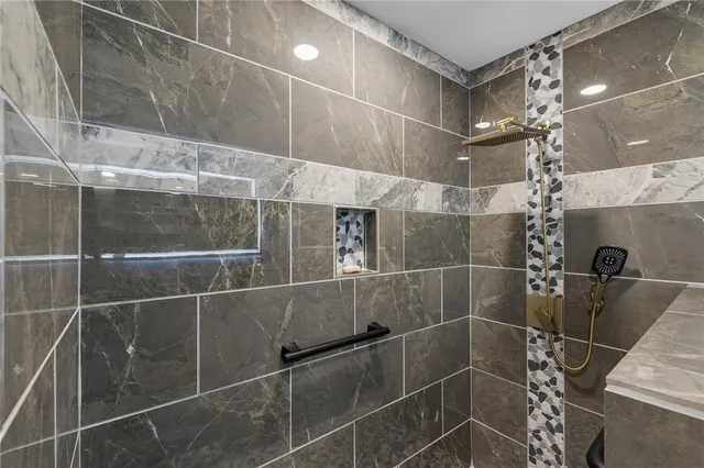 a hall with a cabinet and a dresser