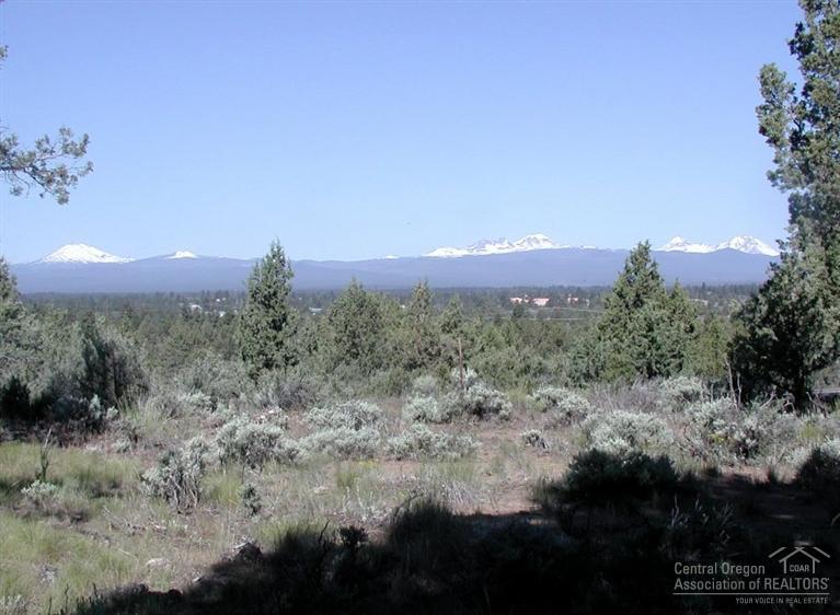 61050 Larsen Road Bend, OR 97702 - Photo 14 of 15 a view of a lake in middle of forest